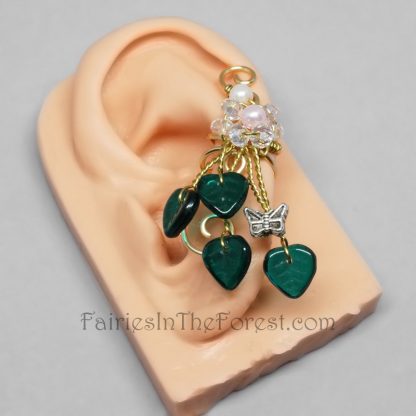 Handmade fairy ear cuff with glass pearls, crystals, green glass leaves and a silver butterfly.
