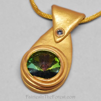 Gold polymer clay and rainbow crystal rivoli pendant.