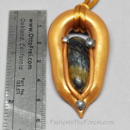 Gold and silver polymer clay pendant with blue Tigereye.
